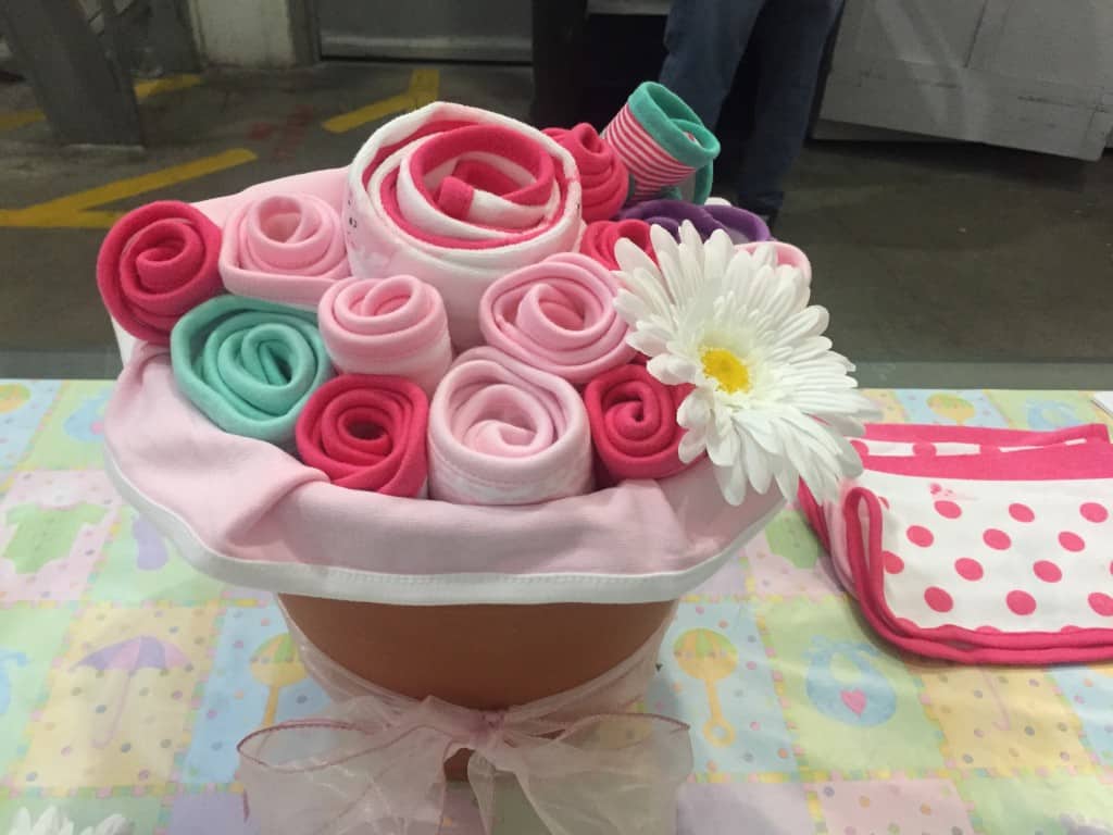 baby shower gift basket ideas - use a planter to hold blankets rolled to look like flowers
